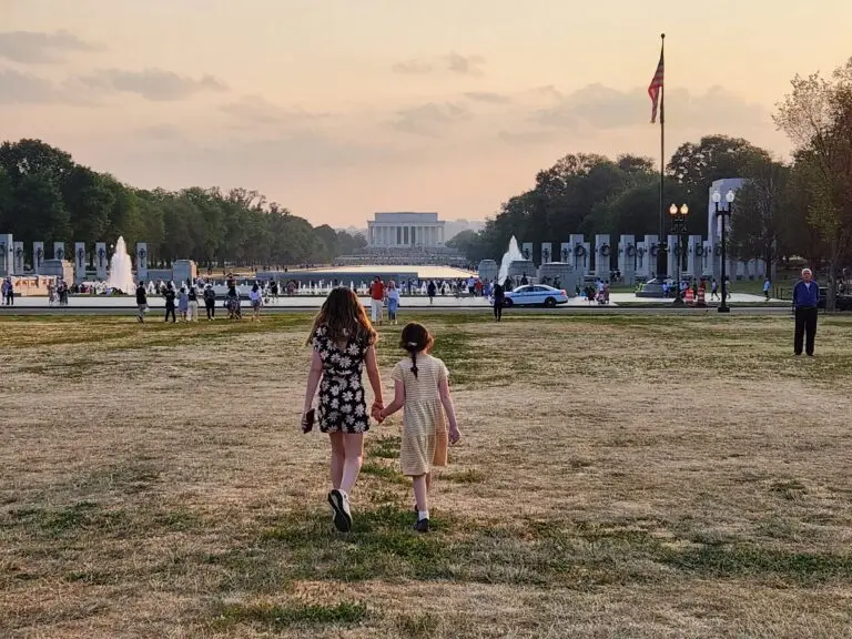Walking on the lawn between the Washington monument and the WWII Memorial