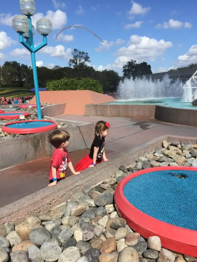 Kids love playing with the jumping water fountain near the Imagination pavilion