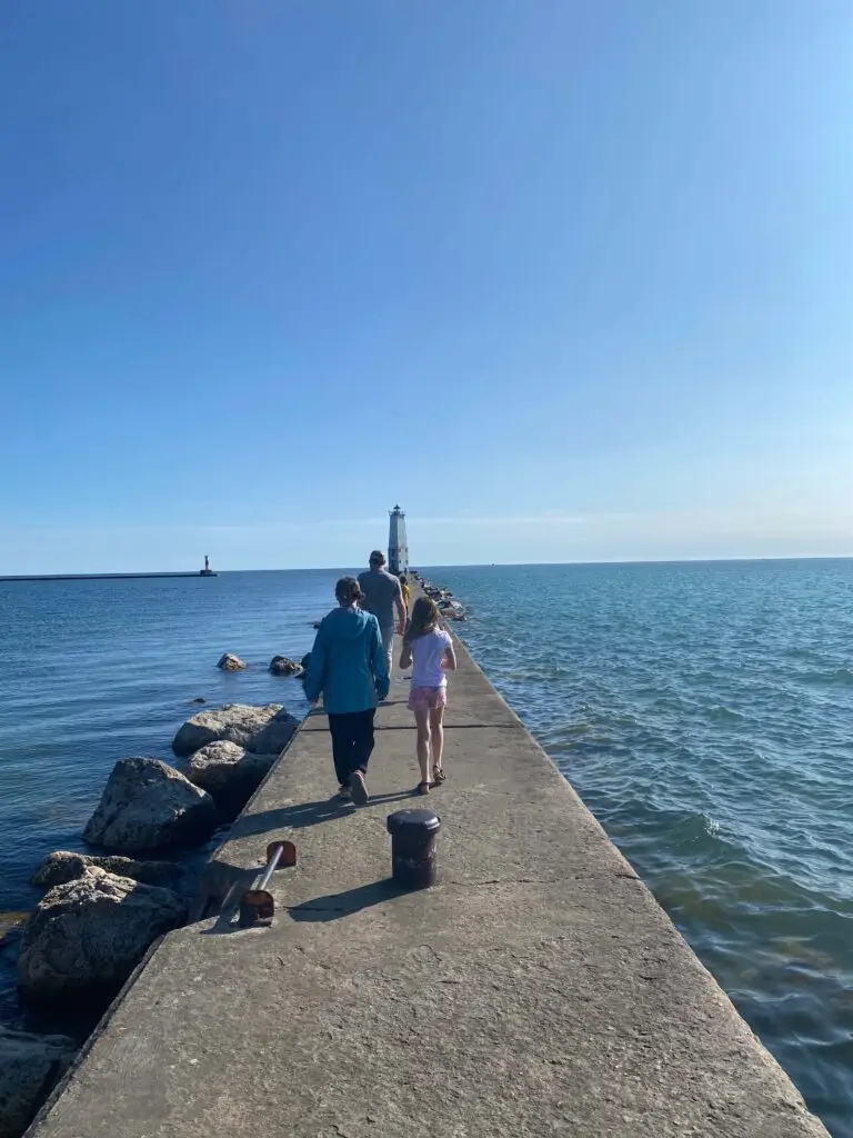 Walk out on the walkway to get to the Frankfort Lighthouse.