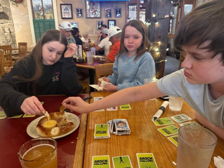 Playing a German game while eating a German pretzel at Fredericksburg Brewing Co.
