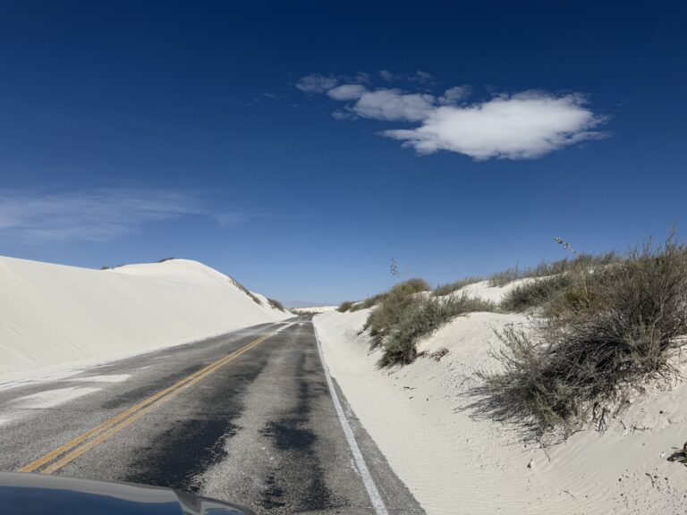 Driving through white sand dunes