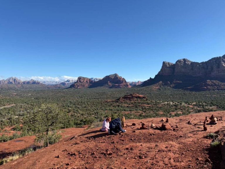 Kids playing with rocks at Bell rock in Sedona, AZ