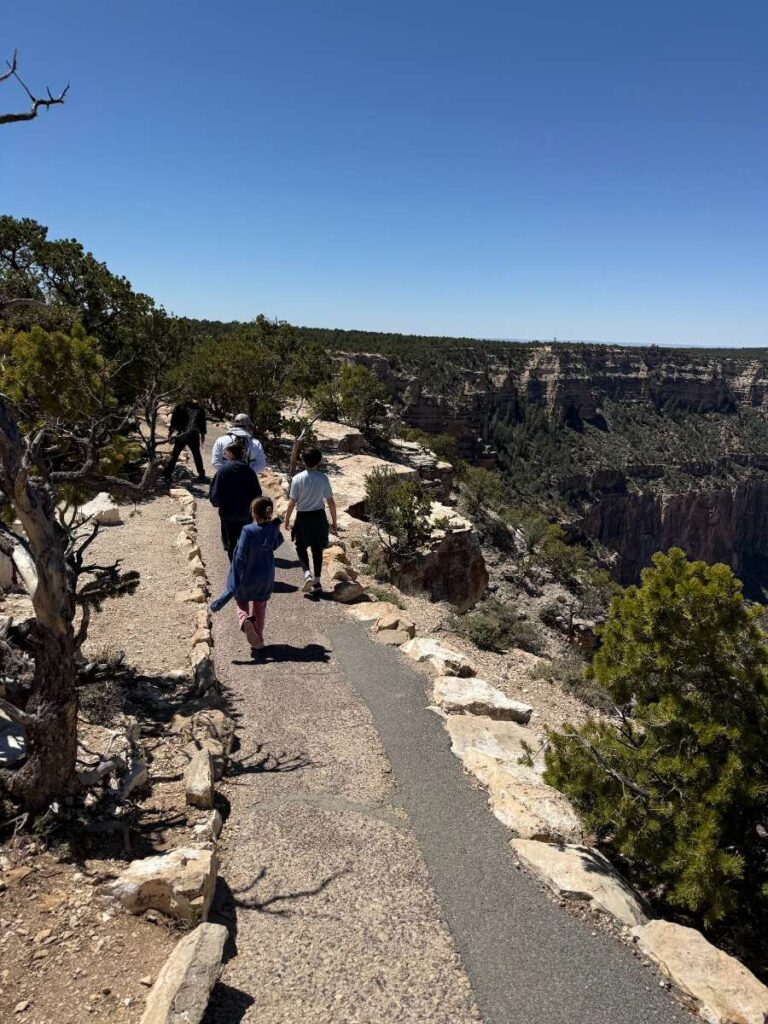 Family walking along the rim trail in Grand Canyon National Park